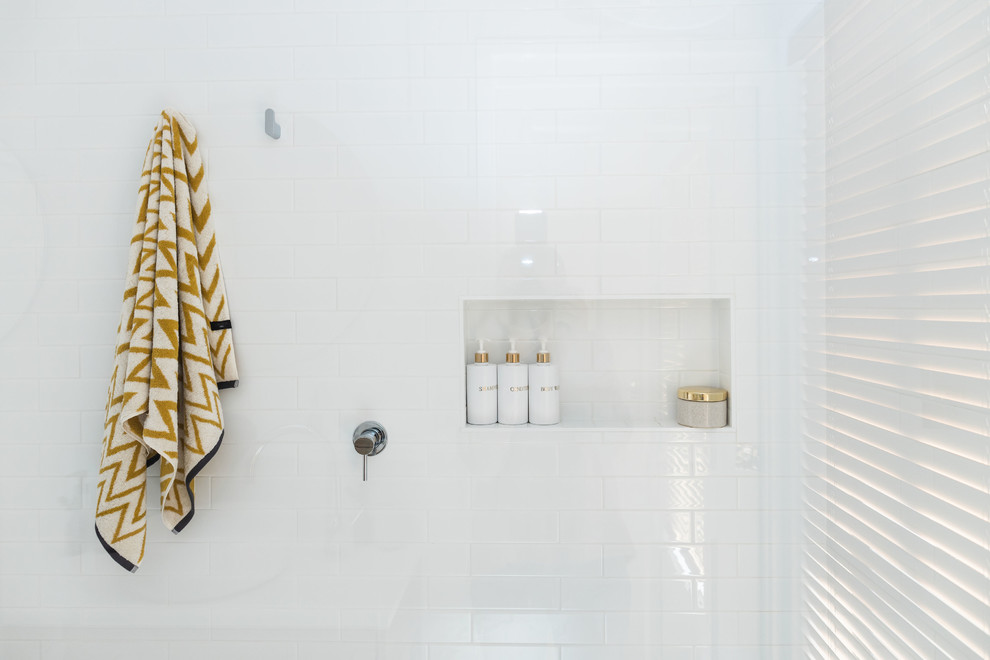 Inspiration for a mid-sized contemporary master wet room bathroom in Canberra - Queanbeyan with light wood cabinets, white tile, subway tile, white walls, porcelain floors, a vessel sink, engineered quartz benchtops, white floor, an open shower and white benchtops.