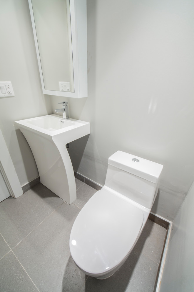 Design ideas for a small modern 3/4 bathroom in New York with flat-panel cabinets, white cabinets, a one-piece toilet, white tile, ceramic floors, a pedestal sink, beige floor and white benchtops.