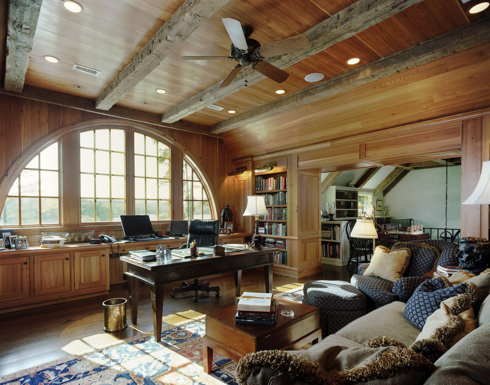 Traditional home office in Atlanta with dark hardwood floors and a freestanding desk.