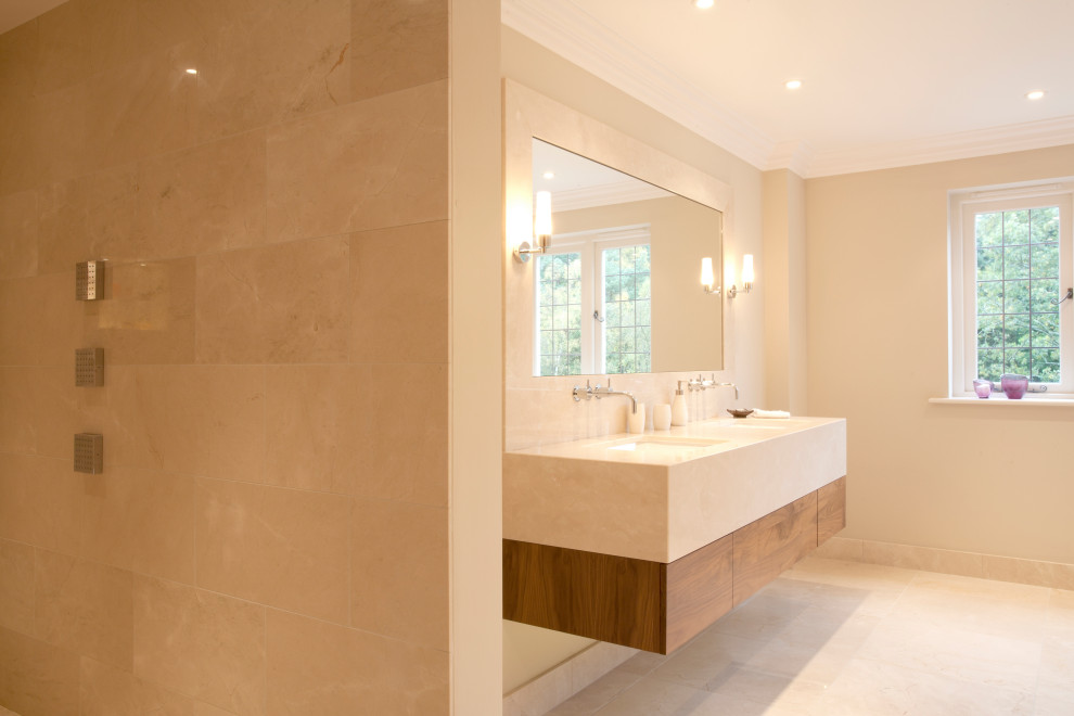 Inspiration for a mid-sized contemporary master bathroom in Berkshire with flat-panel cabinets, brown cabinets, an open shower, limestone floors, limestone benchtops, yellow floor, an open shower, yellow benchtops, a double vanity and a floating vanity.