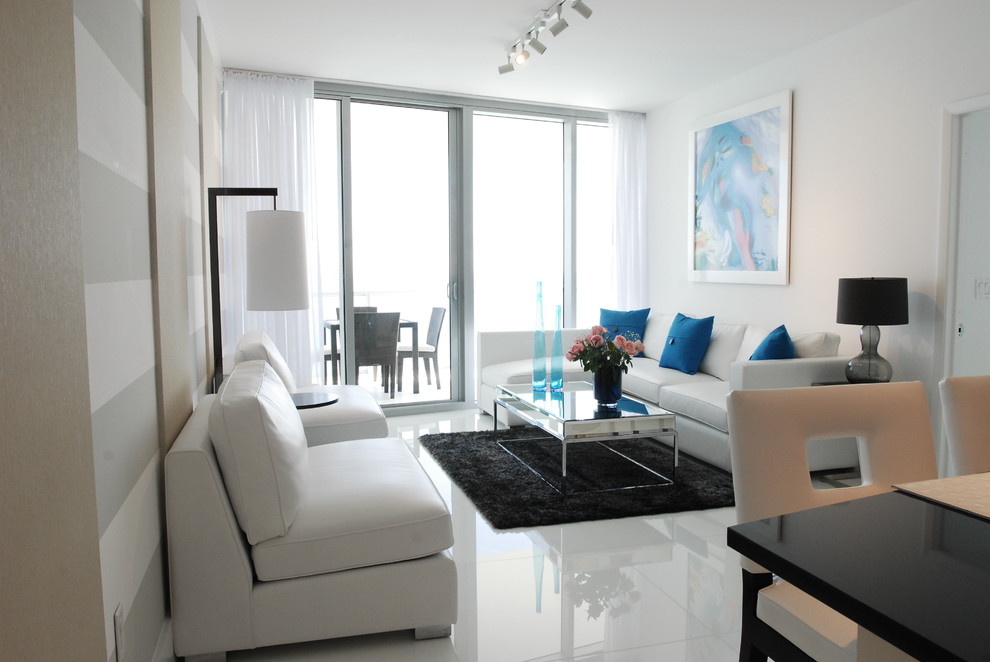 Design ideas for a mid-sized contemporary living room in Miami with white walls and white floor.