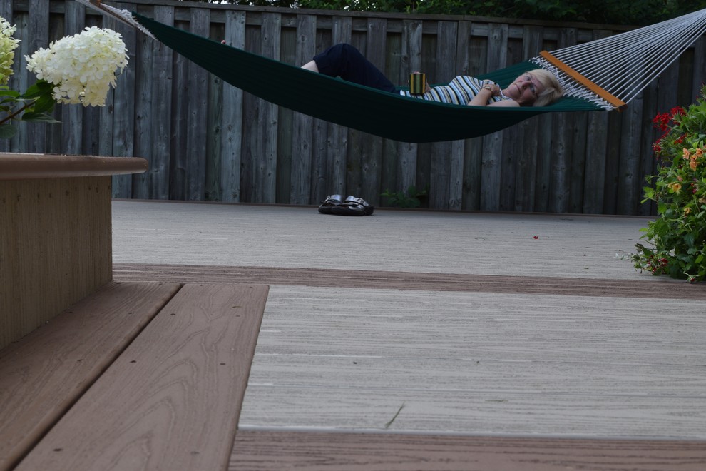 Mid-sized backyard deck container garden photo
