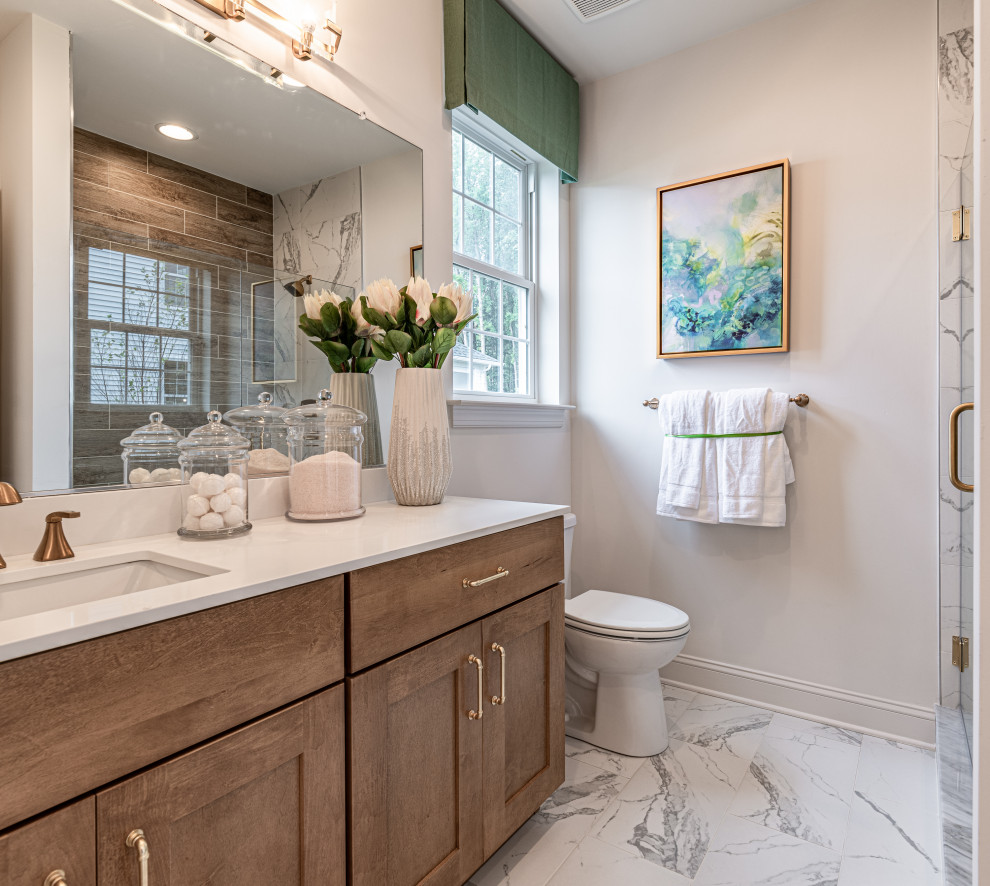 Transitional bathroom in Wilmington with shaker cabinets, medium wood cabinets, white walls, an undermount sink, white floor and white benchtops.