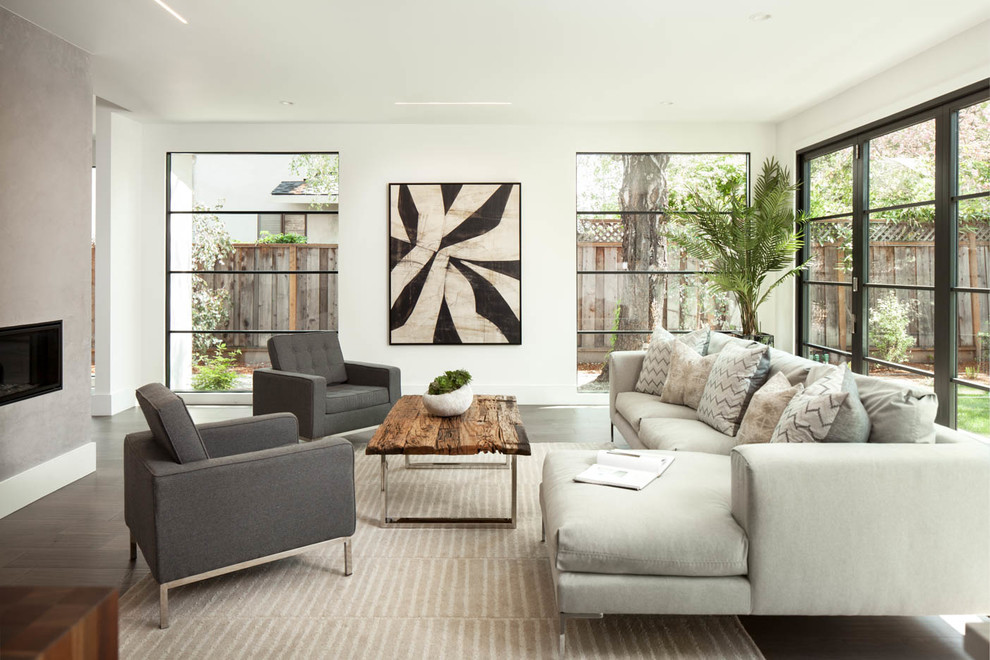Design ideas for a transitional formal living room in San Francisco with white walls, dark hardwood floors, a ribbon fireplace, a concrete fireplace surround, no tv and brown floor.