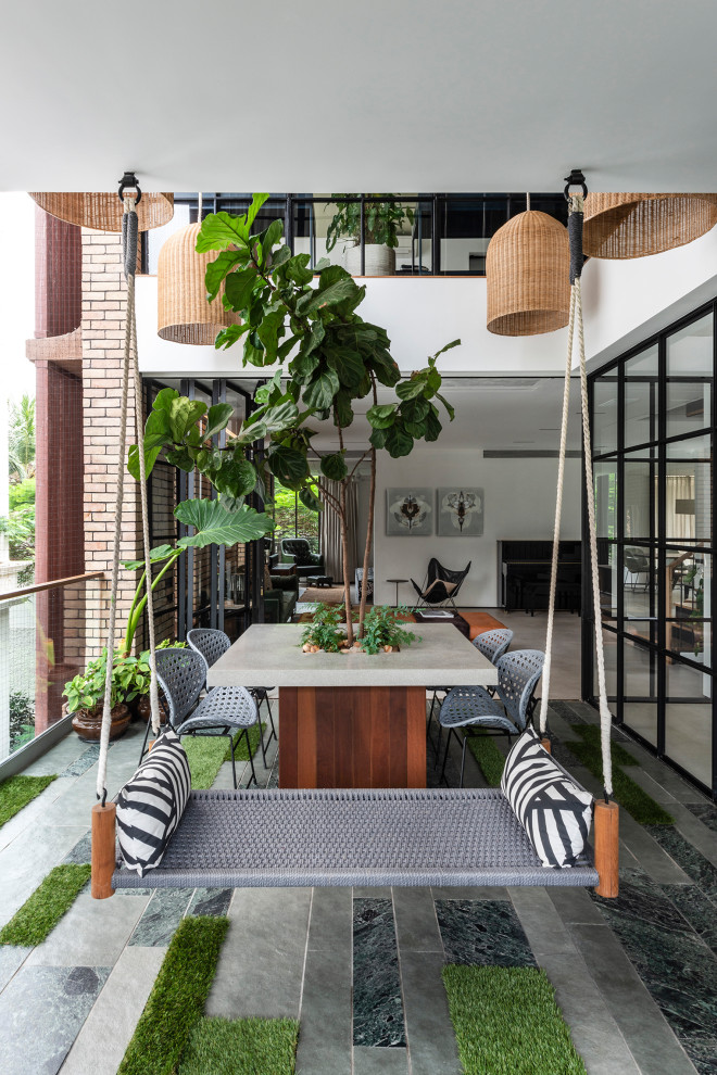 Inspiration for an urban terrace in Mumbai with feature lighting.
