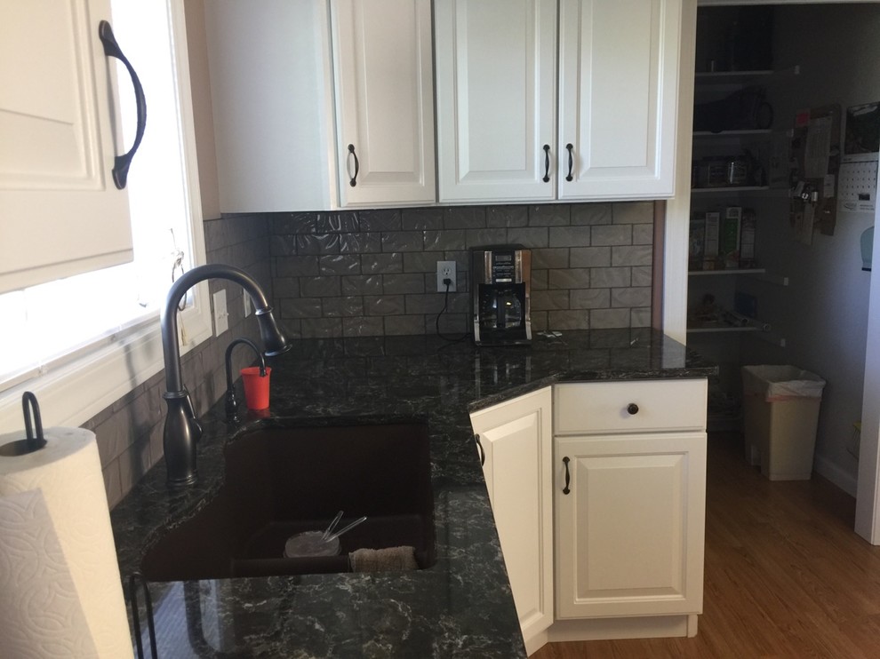 Example of a transitional kitchen design with gray backsplash and glass tile backsplash