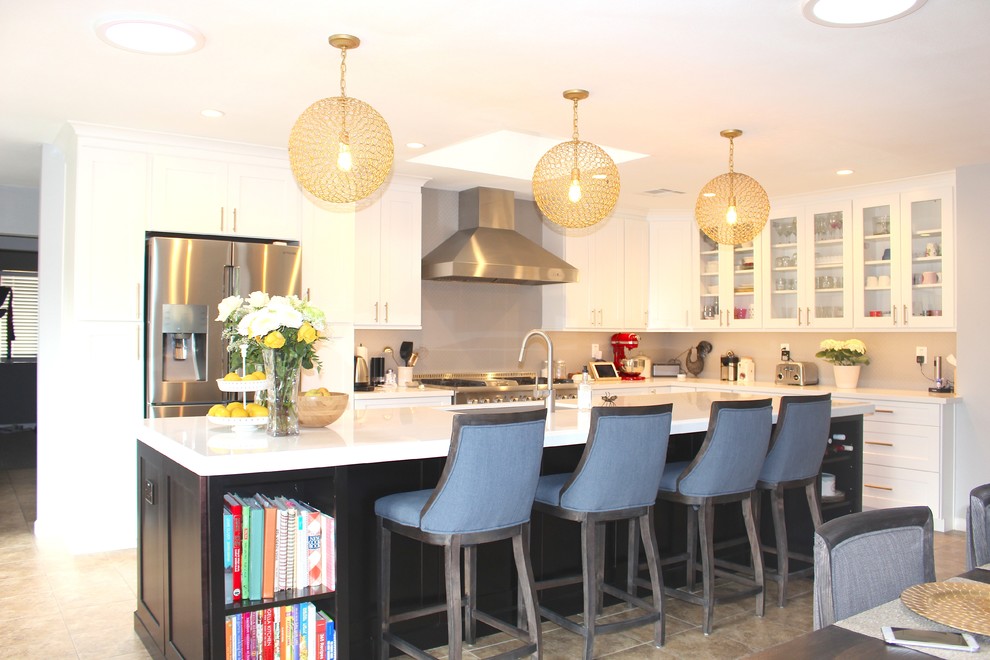 Inspiration for a large transitional l-shaped ceramic tile and beige floor open concept kitchen remodel in Phoenix with an undermount sink, shaker cabinets, white cabinets, quartzite countertops, gray backsplash, stainless steel appliances and an island