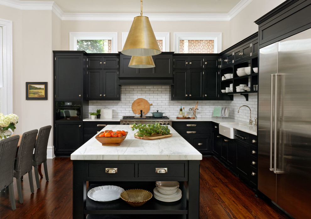 Design ideas for a large transitional l-shaped eat-in kitchen in DC Metro with a farmhouse sink, white splashback, subway tile splashback, stainless steel appliances, with island, brown floor, quartzite benchtops, shaker cabinets and dark hardwood floors.