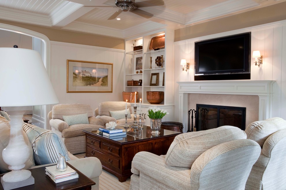 Inspiration for a mid-sized traditional living room in New York with a standard fireplace and a wall-mounted tv.