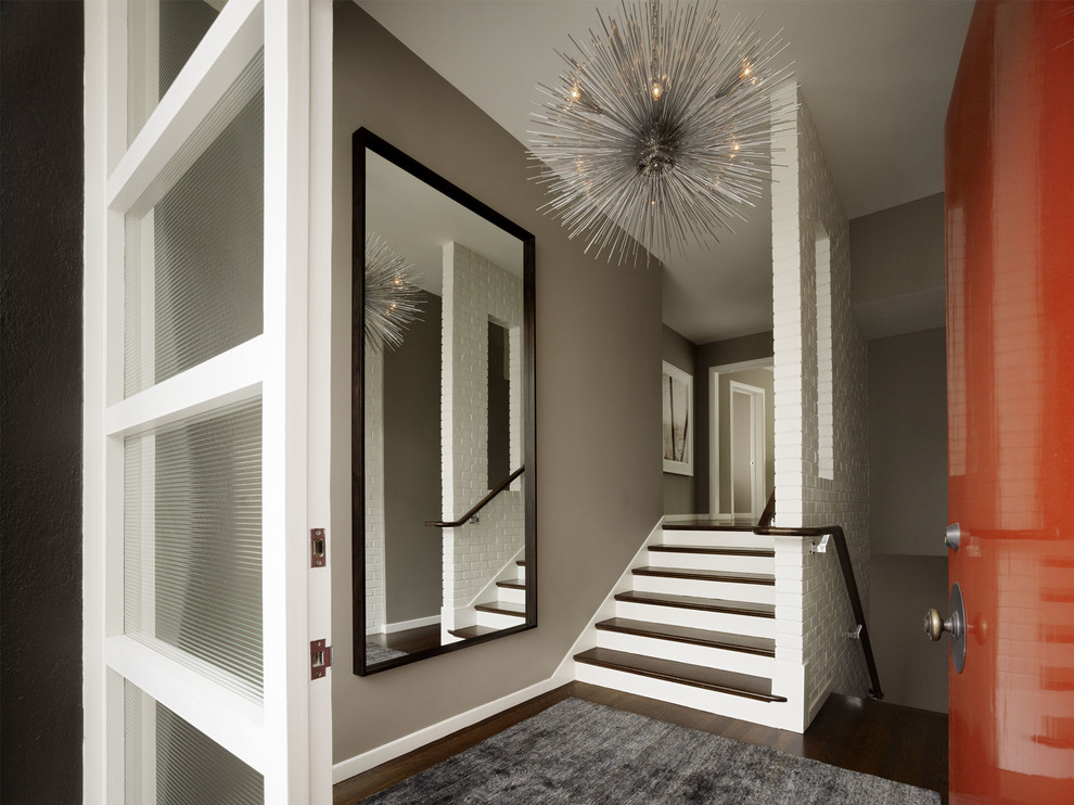 Inspiration for a mid-sized transitional hallway in San Francisco with beige walls and carpet.