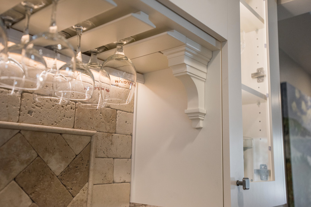Large transitional u-shaped medium tone wood floor and brown floor eat-in kitchen photo with an undermount sink, shaker cabinets, white cabinets, granite countertops, beige backsplash, paneled appliances and an island