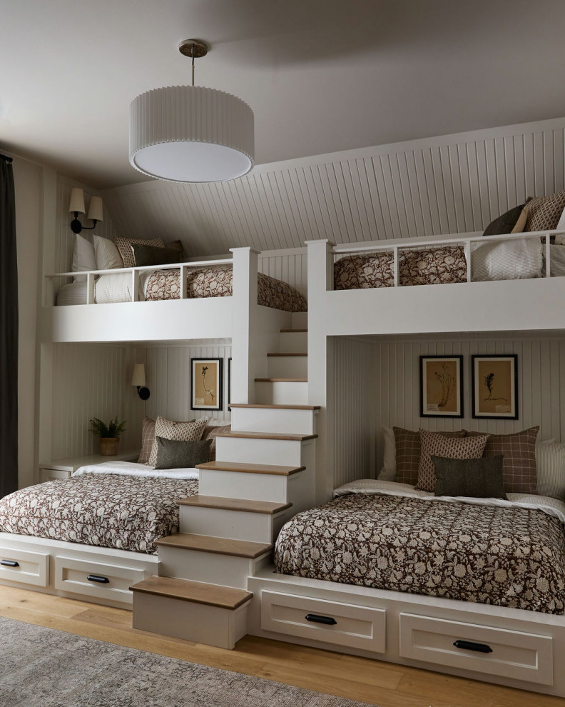 Example of a country gender-neutral light wood floor, beige floor and shiplap wall kids' bedroom design in Oklahoma City with white walls