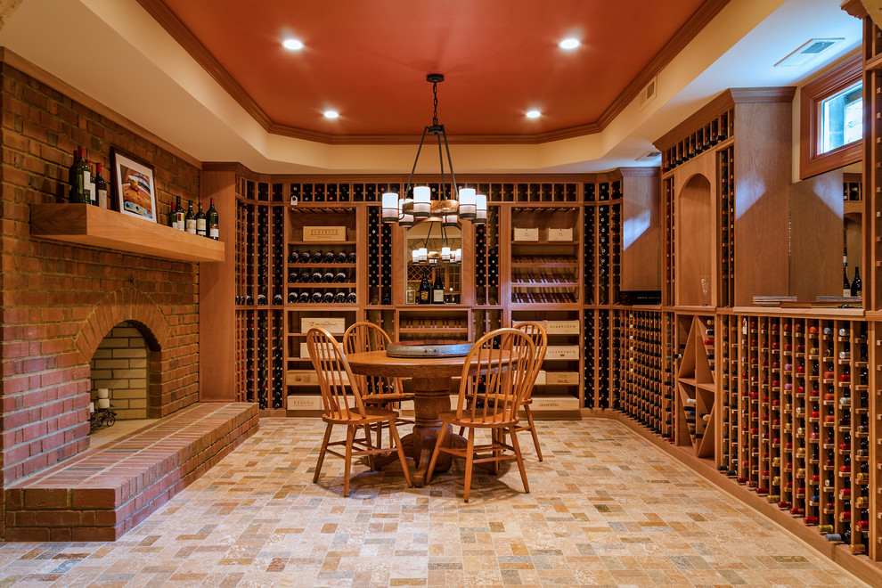 Inspiration for a large traditional wine cellar in Richmond with storage racks and travertine floors.