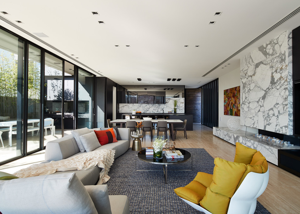 Design ideas for a contemporary formal open concept living room in Melbourne with white walls, a ribbon fireplace, a stone fireplace surround, no tv and brown floor.