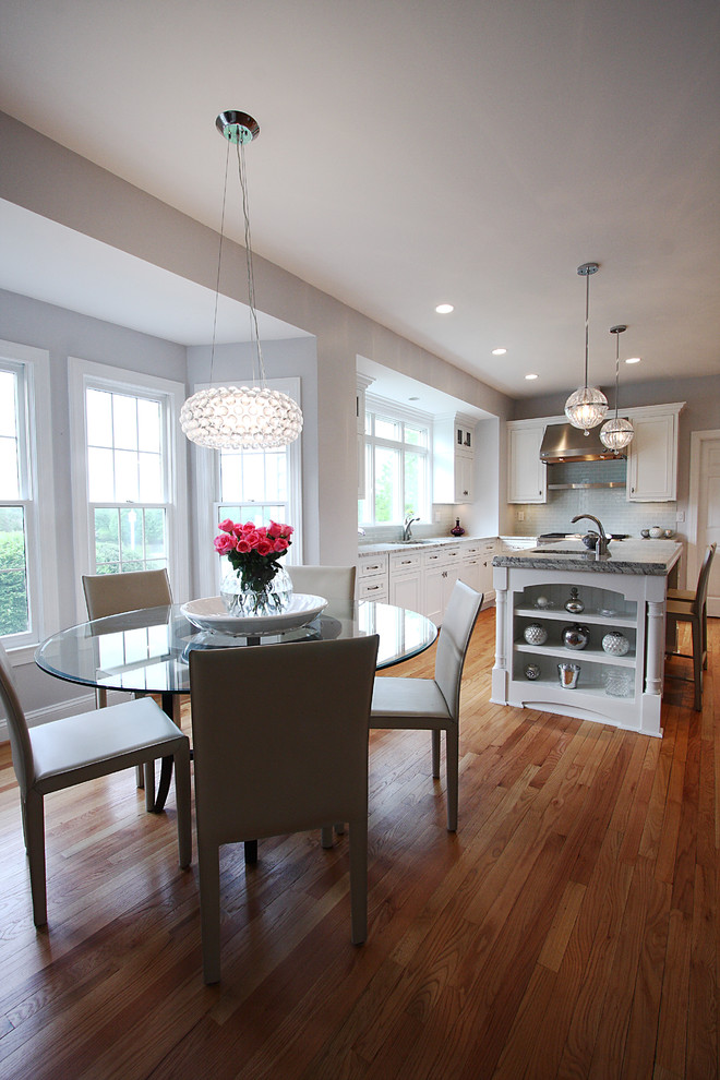 Traditional eat-in kitchen in DC Metro with white cabinets.