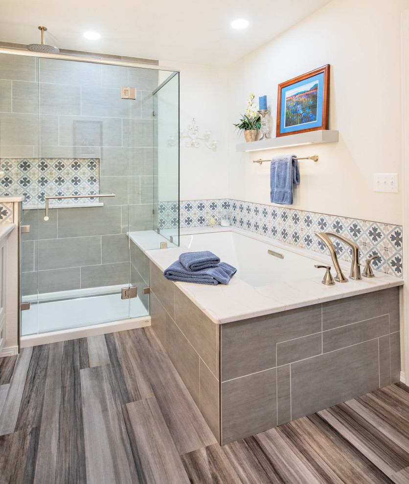 Large transitional master blue tile and porcelain tile vinyl floor, gray floor and double-sink double shower photo with beaded inset cabinets, gray cabinets, an undermount tub, a one-piece toilet, gray walls, an undermount sink, quartz countertops, a hinged shower door, white countertops and a built-in vanity