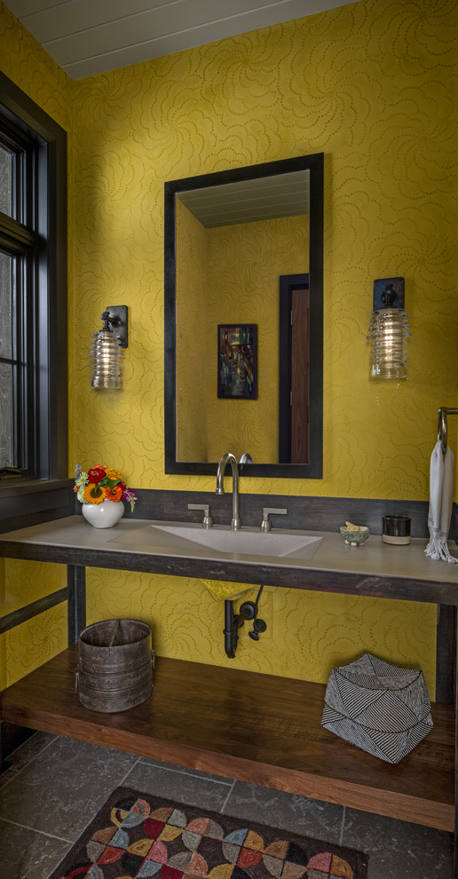 Coastal cloakroom in Detroit with yellow walls, dark hardwood flooring, an integrated sink and grey worktops.