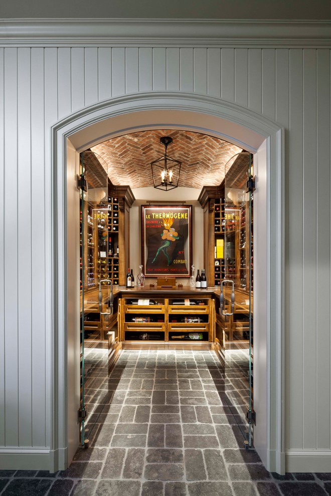 Design ideas for a mid-sized eclectic wine cellar in Other with grey floor.