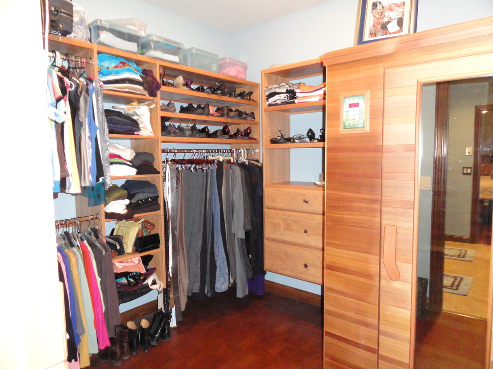 Design ideas for a contemporary gender-neutral walk-in wardrobe in Other with cork floors.