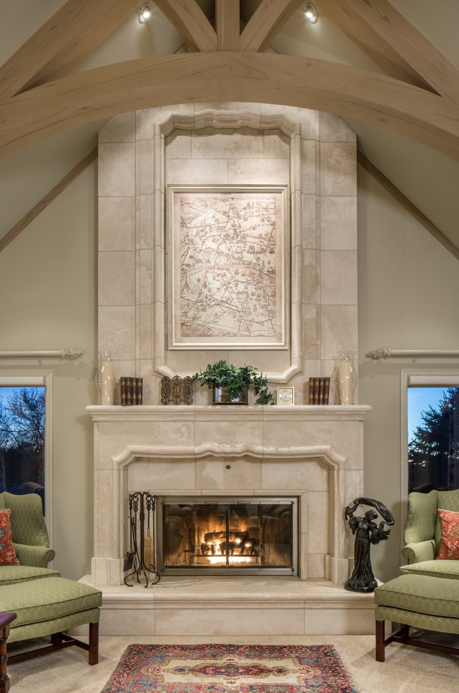 Photo of a large traditional formal enclosed living room in Omaha with beige walls, carpet, a standard fireplace, a tile fireplace surround and no tv.