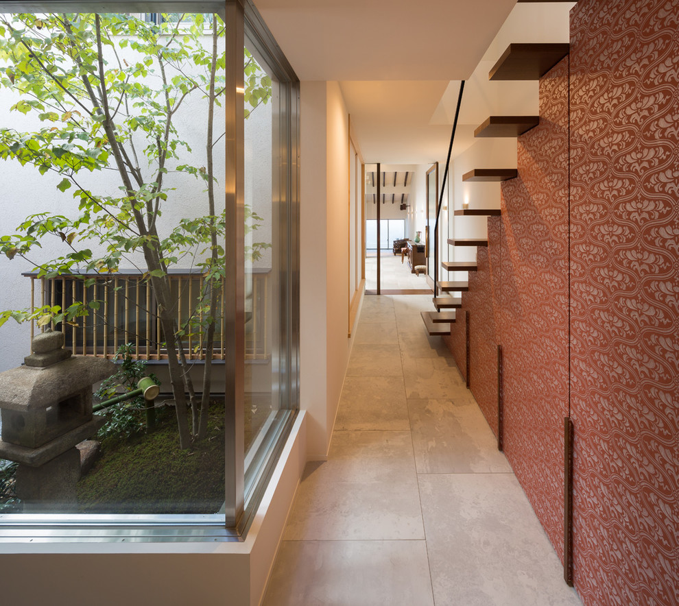 Contemporary hallway in Kyoto with white walls.