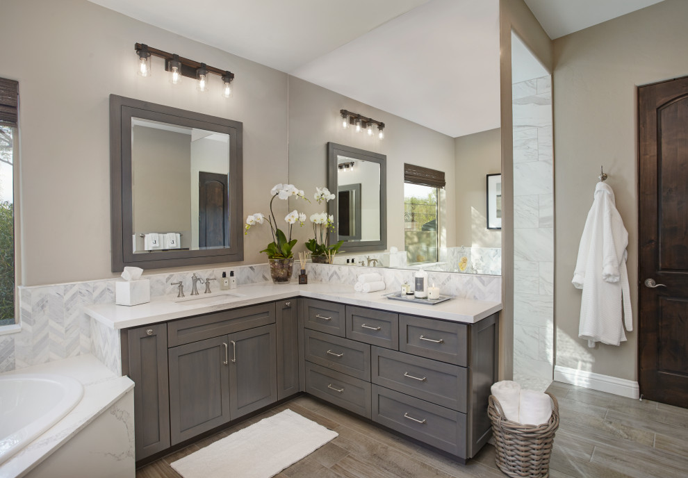 Large country master bathroom in Phoenix with shaker cabinets, grey cabinets, a drop-in tub, an open shower, white tile, porcelain tile, grey walls, porcelain floors, an undermount sink, engineered quartz benchtops, grey floor, an open shower and grey benchtops.