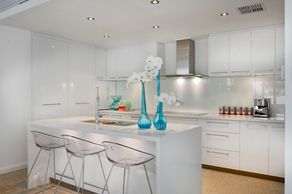 Design ideas for a contemporary galley kitchen in Perth with flat-panel cabinets, white cabinets, white splashback, glass sheet splashback and with island.
