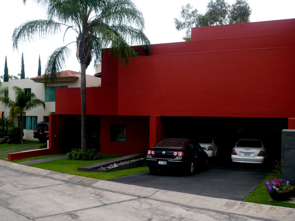 Mid-sized contemporary three-storey brown house exterior in Mexico City with a gable roof.