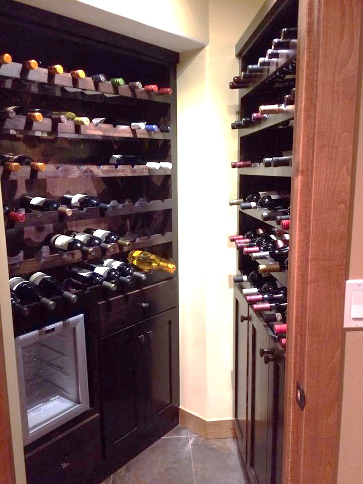 Wine cellar - small transitional ceramic tile wine cellar idea with storage racks