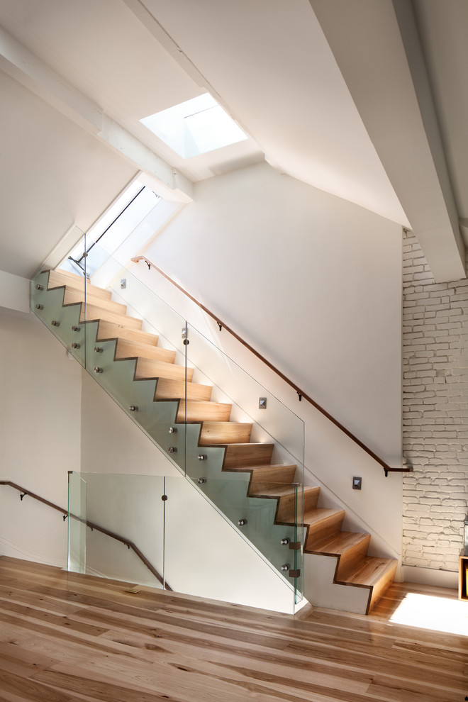 Inspiration for a mid-sized contemporary wood straight staircase in Boston with wood risers.