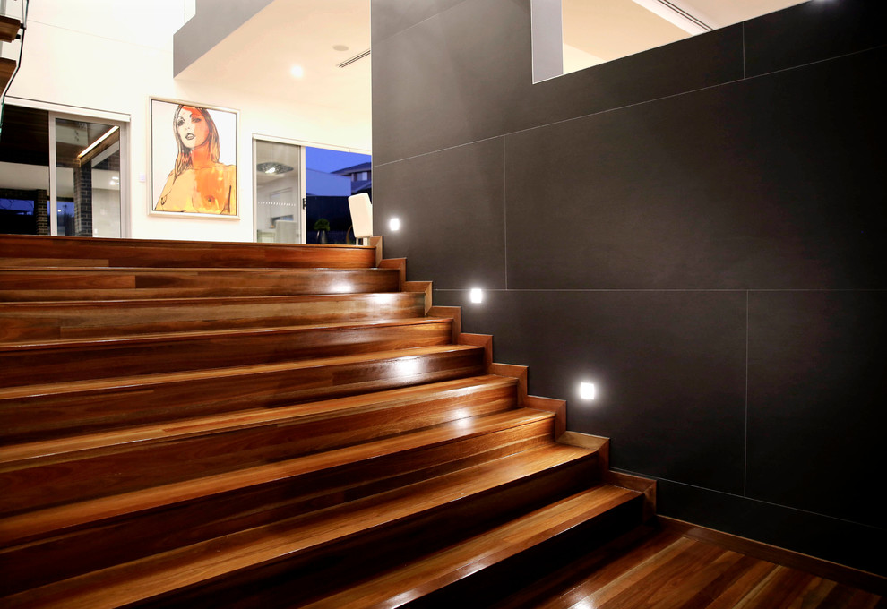 Photo of a large contemporary staircase in Sydney.
