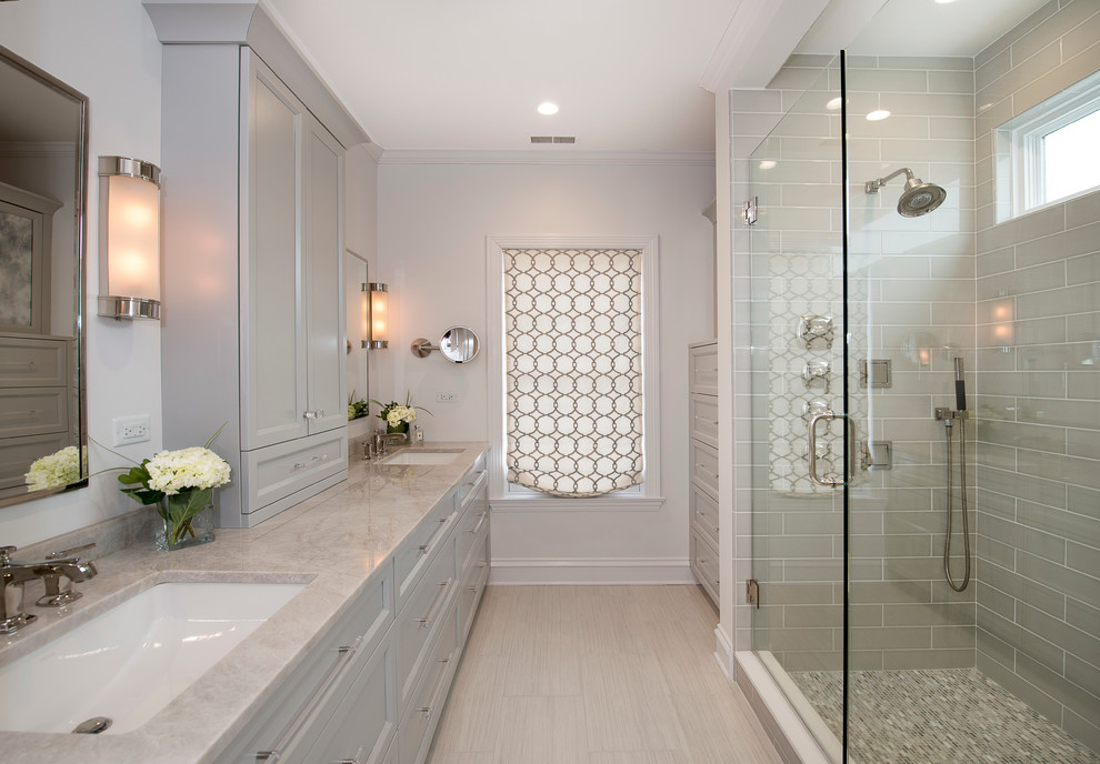 Large transitional master gray tile porcelain tile alcove shower photo in Chicago with gray cabinets, a one-piece toilet, white walls and an undermount sink