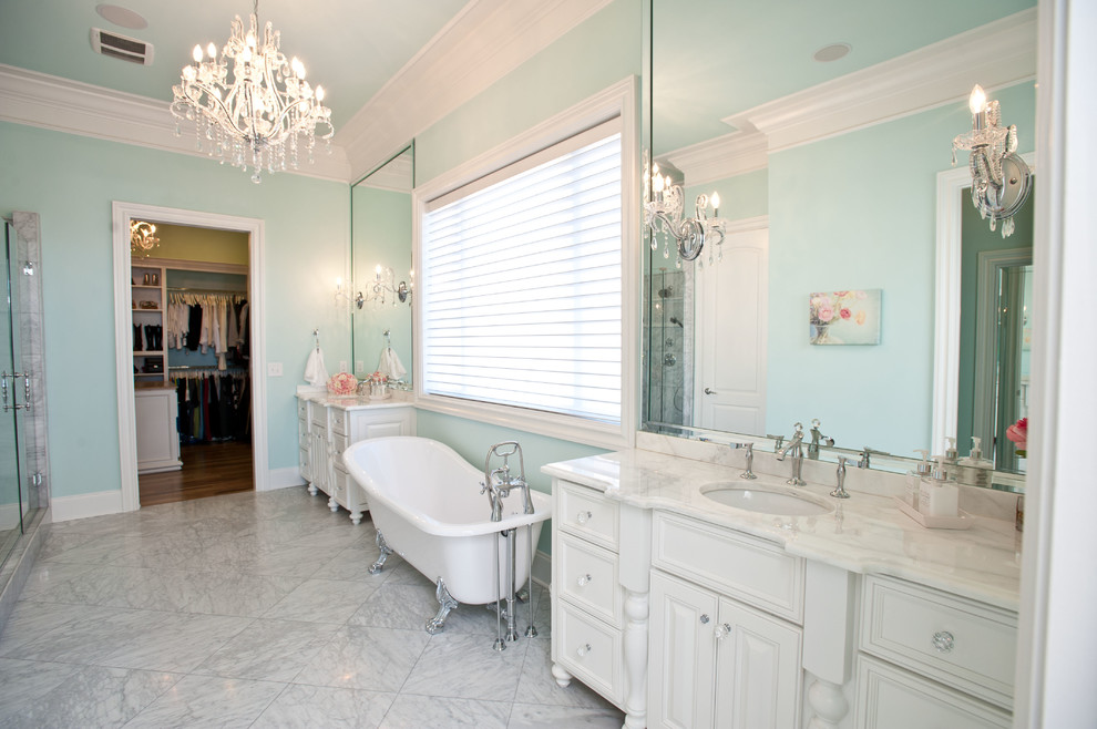Inspiration for an expansive traditional master bathroom in Nashville with an undermount sink, flat-panel cabinets, white cabinets, granite benchtops, a claw-foot tub, a corner shower, a one-piece toilet, gray tile, porcelain tile, blue walls and porcelain floors.