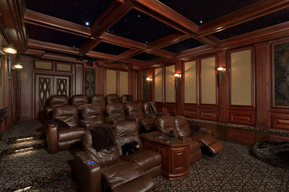 This is an example of a large traditional enclosed home theatre in Charlotte with brown walls, carpet, a projector screen and yellow floor.
