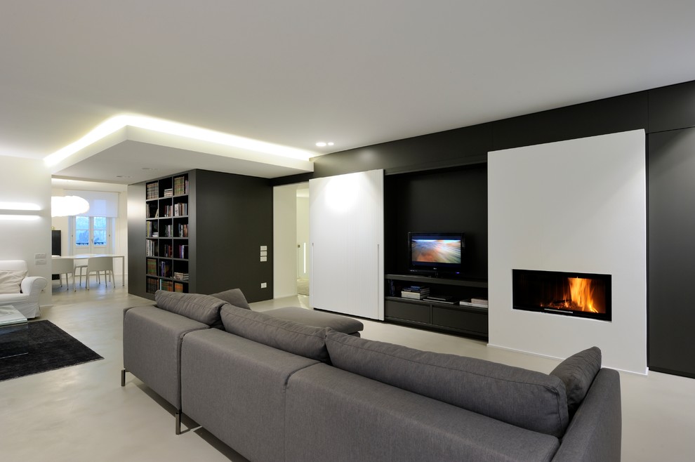 Inspiration for a large modern open concept living room in Other with a library, multi-coloured walls, a ribbon fireplace, a freestanding tv and beige floor.