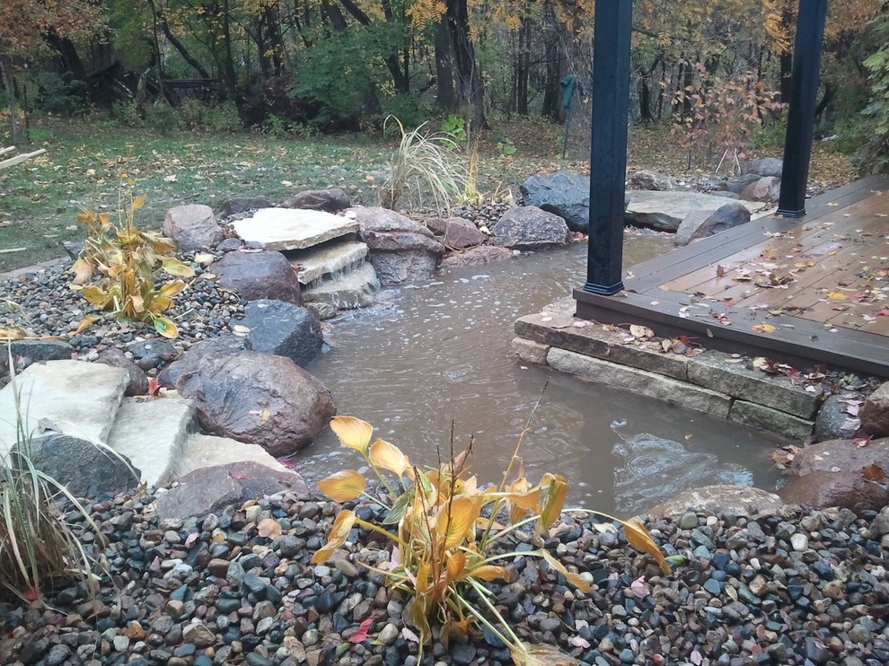 Inspiration for a mid-sized rustic partial sun backyard gravel formal garden for spring.