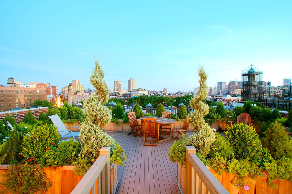 Photo of a large traditional rooftop and rooftop deck in New York with no cover and a container garden.