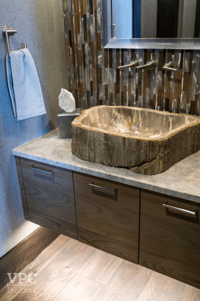 Inspiration for a mid-sized contemporary 3/4 bathroom in Charlotte with medium wood cabinets, a freestanding tub, a corner shower, brown walls, a vessel sink, an open shower, a single vanity, a built-in vanity and wood walls.