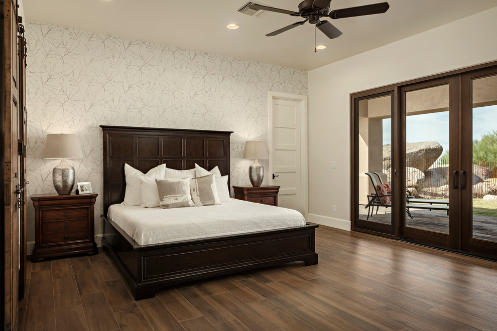 Photo of a mid-sized master bedroom in Phoenix with beige walls, ceramic floors and brown floor.