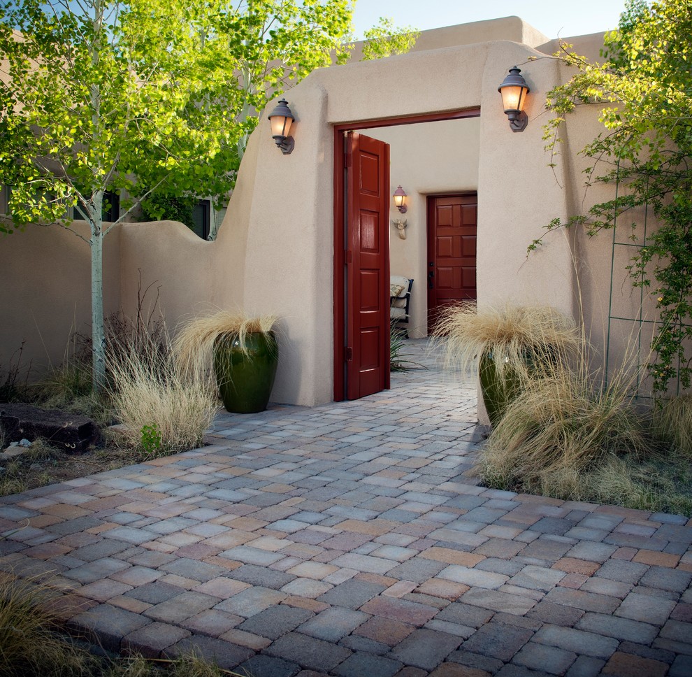 Photo of a large front door in Dallas with red walls, a double front door, a red front door and multi-coloured floor.