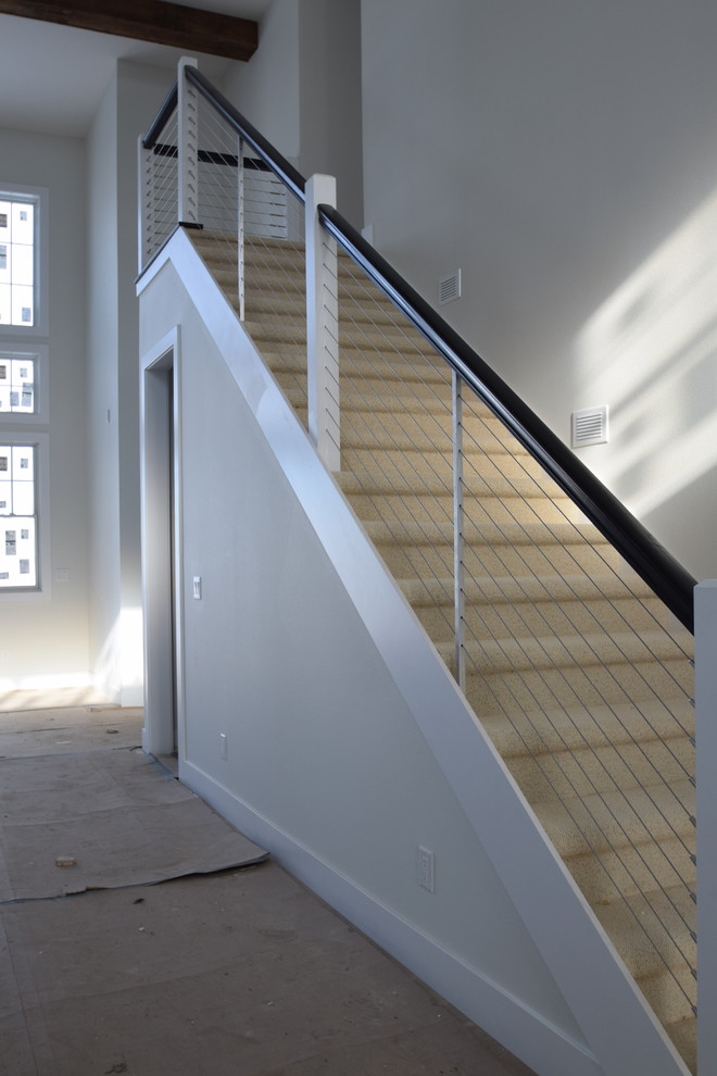 Inspiration for a mid-sized contemporary carpeted straight staircase in Other with carpet risers.