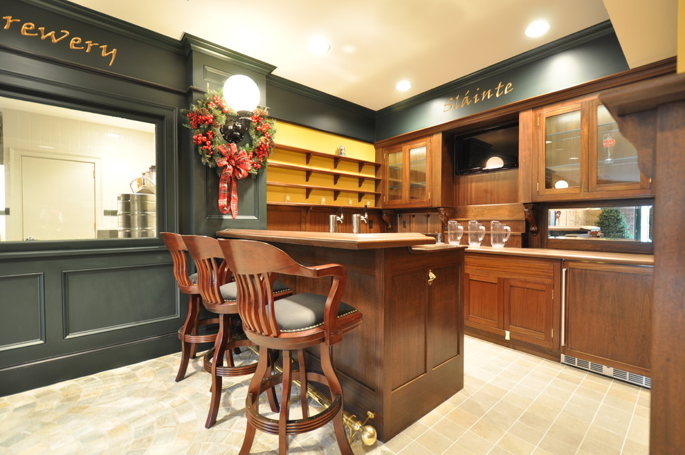 Photo of a large traditional u-shaped seated home bar in New York with glass-front cabinets, dark wood cabinets, wood benchtops, mirror splashback and limestone floors.
