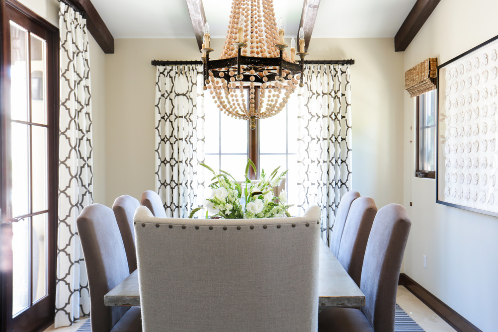 This is an example of a large transitional separate dining room in Orange County with white walls and dark hardwood floors.