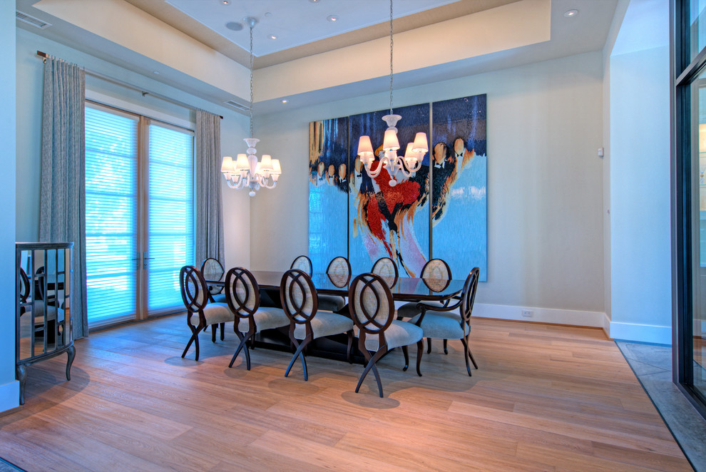 Photo of a large contemporary separate dining room in Phoenix with beige walls, light hardwood floors and no fireplace.