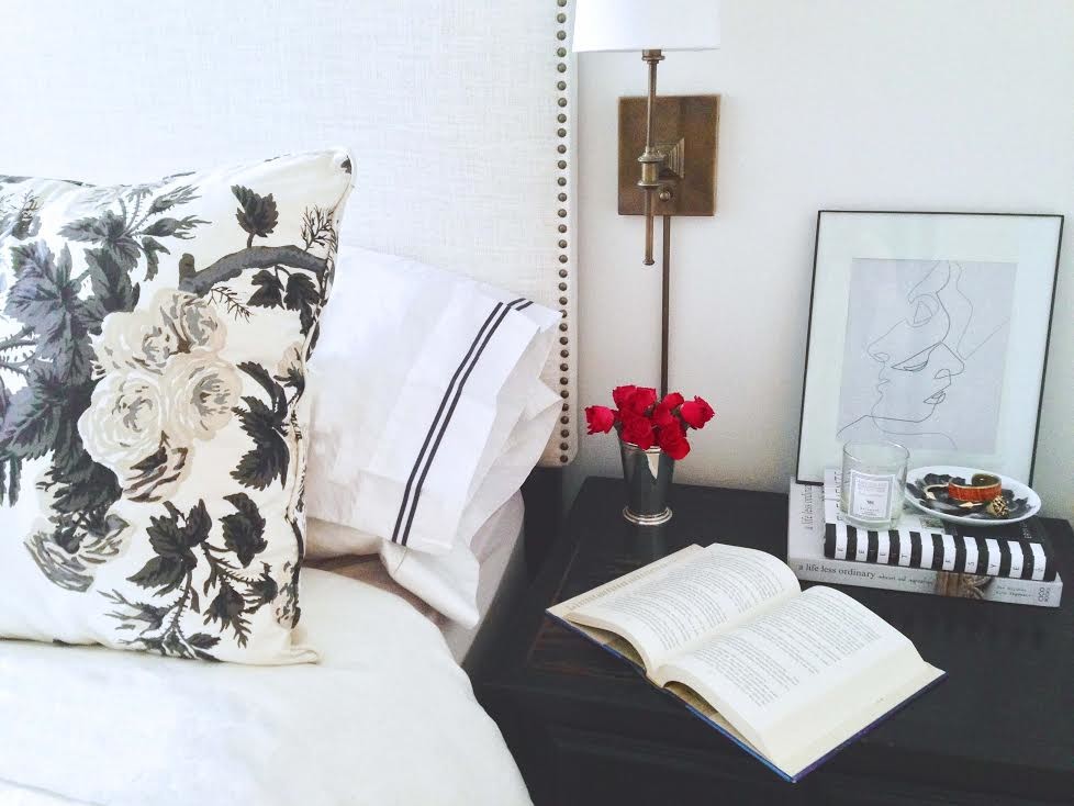 This is an example of a small transitional master bedroom in New York with white walls.