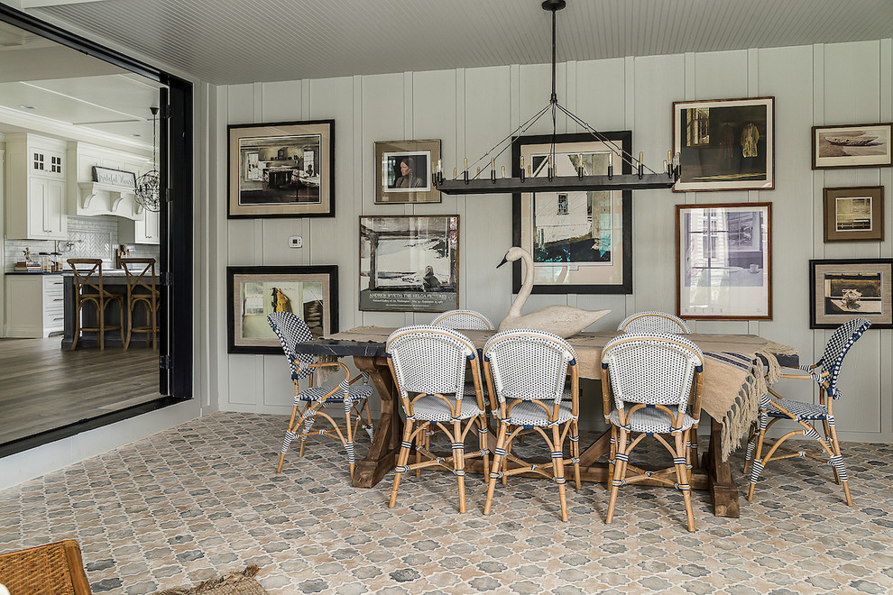 Design ideas for a country dining room in Los Angeles with grey walls, terra-cotta floors, no fireplace and multi-coloured floor.