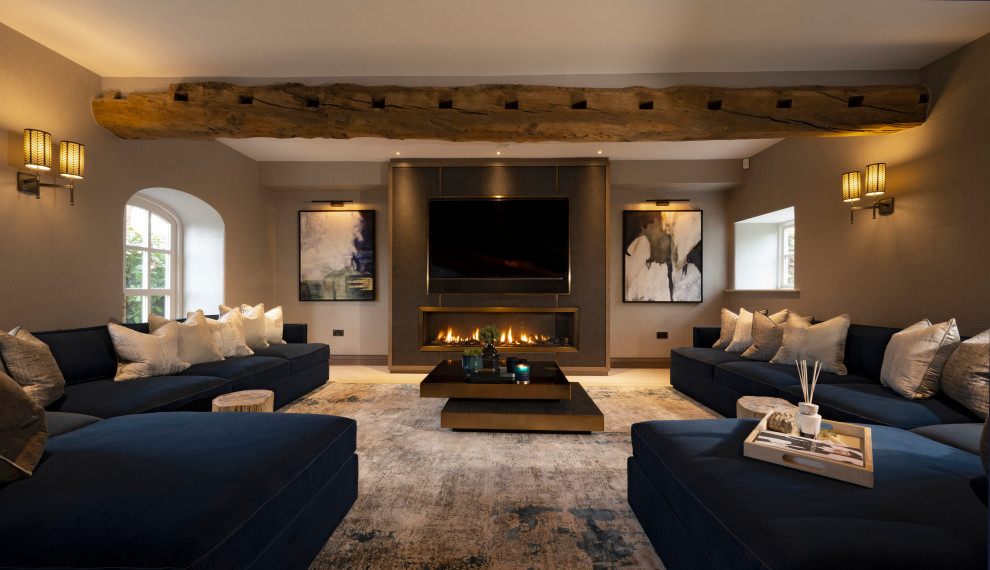 Photo of a medium sized contemporary enclosed living room in Cheshire with beige walls, light hardwood flooring, a ribbon fireplace, white floors and exposed beams.