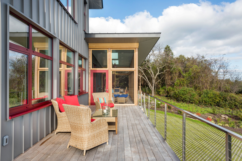 Example of a mid-sized transitional backyard deck design in Providence with no cover