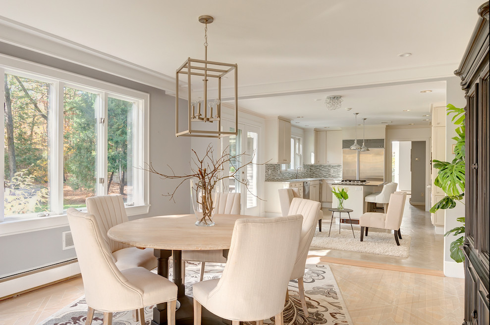 This is an example of a large contemporary open plan dining in Boston.