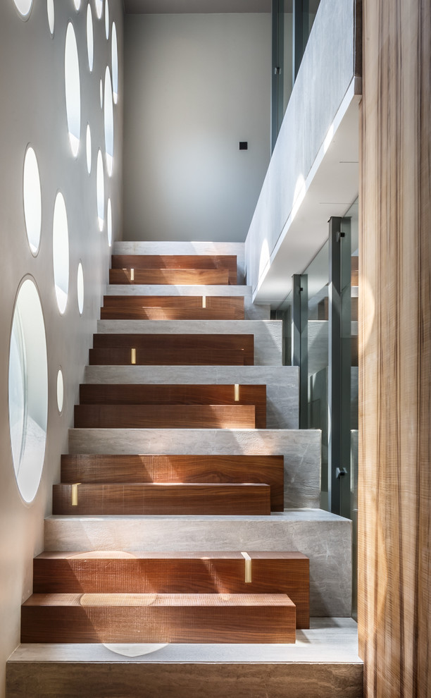 Photo of a contemporary wood straight staircase with wood risers.